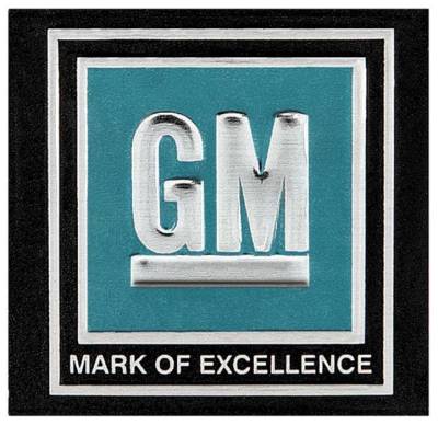 SEAT BELT BUCKLE EMBLEM - GM MARK OF EXCELLENCE - AQUA